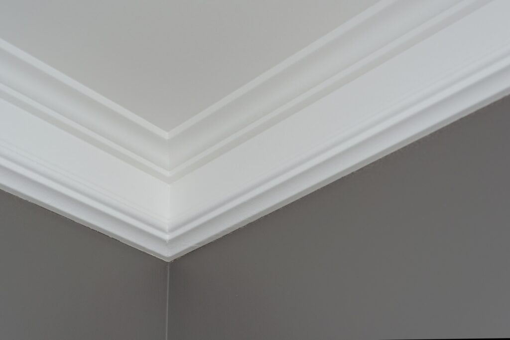 Details in the interior close-up. Ceiling moldings, part of intricate corner.